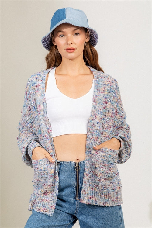  Beat the winter blues with this multi-color cable knit sweater is accented with speckle mixed colors throughout this open cardigan.  Cozy-up with this stunning cardigan this winter season.   95% Arcylic   5% Polyester   Model wearing a size small.  